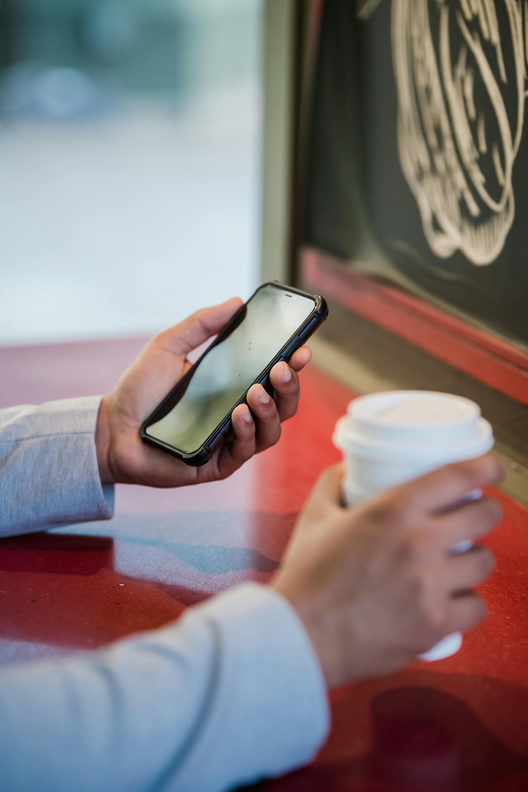 Close-up of a Man Holding a Disposable Coffee Cup and Using Phone, Customer Authentication strong customer authentication authentication keycloak kubernetes keycloak authentication red hat authentication two factor authentication keycloak authentication with keycloak keycloak user authentication keycloak rest api authentication authentication keycloak